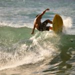 a man surfing on a wave